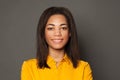 Smart positive black woman smiling and looking at camera, female face close up portrait