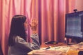 Smart preteen schoolgirl doing her homework with digital tablet at home. Child using gadgets to study. Education and learning for Royalty Free Stock Photo