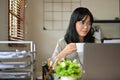 Smart Asian businesswoman or female accountant concentrating on her work Royalty Free Stock Photo