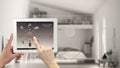 Smart remote home control system on a digital tablet. Device with app icons. Blurry interior of modern loft in the background, arc Royalty Free Stock Photo