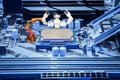 Smart robot and industrial robotic welding working with CPU processor on PC motherboard concept Royalty Free Stock Photo