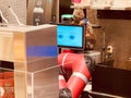 Intelligent red robot making coffee at Henn na cafe in Shibuya, Japan