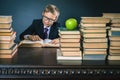 Smart school boy reading a book at library Royalty Free Stock Photo