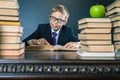 Smart school boy reading a book at library Royalty Free Stock Photo