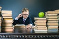 Smart school boy reading a book at library Royalty Free Stock Photo