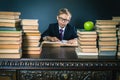 Smart school boy reading a book at library Royalty Free Stock Photo