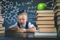 Smart school girl reading a book at library Royalty Free Stock Photo