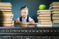 Smart school girl reading a book at library Royalty Free Stock Photo