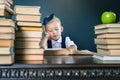 Smart school girl reading a book at library Royalty Free Stock Photo