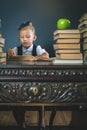 Smart school girl reading a book at library Royalty Free Stock Photo