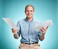 Smart smiling student with great idea holding sheets of paper Royalty Free Stock Photo