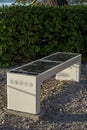 Smart Solar Bench in public place, powered by sunlight provides wireless and wired charging for users, free wifi and temperature