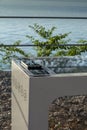 Smart Solar Bench in public place, powered by sunlight provides wireless and wired charging for users, free wifi and temperature