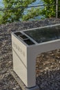 Smart Solar Bench in public place, powered by sunlight provides wireless and wired charging for users, free wifi and temperature