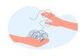 Smart solution for complicated puzzle of mess and chaos, two hands holding knot of thread Royalty Free Stock Photo