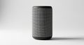 Smart speaker with a cylindrical shape, featuring a textured gray fabric grille. The Royalty Free Stock Photo