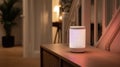 Smart speaker placed on a hallway console softly glowing while generating customizable white noise to muffle distant Royalty Free Stock Photo
