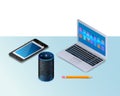 Smart speaker for smart home control. Modern laptop, a mobile phone, pencil. Royalty Free Stock Photo