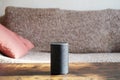 Smart speaker standing on coffee table Royalty Free Stock Photo