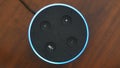 Smart speaker top view artificial intelligence assistant voice control blue ring button activation