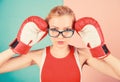 Smart and strong. Woman boxing gloves adjust eyeglasses. Win with strength or intellect. Strong intellect victory pledge