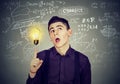 Smart student with bright idea light bulb Royalty Free Stock Photo