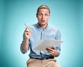 Smart surprised student with great idea holding sheets of paper Royalty Free Stock Photo