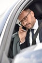 Smart taxi driver making a phonecall Royalty Free Stock Photo