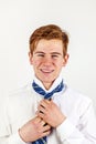 Smart teen boy knots his tie Royalty Free Stock Photo