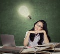 Smart teenage student with lightbulb Royalty Free Stock Photo