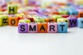 SMART text on colorful plastic beads representing Specific, Measurable, Achievable, Relevant and Time Bound