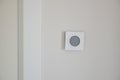 Smart Thermostat on White Wall for Optimal Home Temperature Control Royalty Free Stock Photo