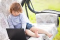 Smart toddler girl using laptop computer, child and technology Royalty Free Stock Photo