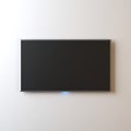 Smart TV Mockup, modern LED TV hanging on the wall Royalty Free Stock Photo