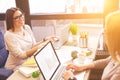 Smart two businesswomen using laptops for work Royalty Free Stock Photo