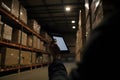 Smart warehouse management system. Worker hands holding tablet. Neural network AI generated Royalty Free Stock Photo