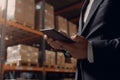 Smart warehouse management system. Worker hands holding tablet. Neural network AI generated Royalty Free Stock Photo