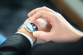 Smart watch with touch screen. Business man using wearable device with mobile technology. Smartwatch with finance report.