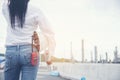 Smart woman engineer holding White safety hard hat helmet for security equipment and blueprint paper working at Petroleum Oil Royalty Free Stock Photo