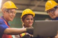 Smart woman engineer working around with men team mix race work together in heavy industry looking and discussion problem on Royalty Free Stock Photo