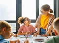 Teacher conducts a lesson, gives a lecture children during school work