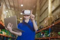 smart worker using modern advance technology digital VR device to control operate manage industry products stock warehouse Royalty Free Stock Photo