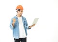 Smart young asian architect engineer man wear casual jean and orange safety helmet which hands holding laptop to check his planned Royalty Free Stock Photo