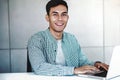 Smart Young Asian Businessman Working on Computer Laptop in Office. Happy Smiling Guy Royalty Free Stock Photo