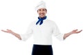 Smart young chef welcoming guests Royalty Free Stock Photo