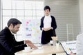 Smart young handsome businessman black suit in seriously discussing meeting, businesspeople have discussion about business project Royalty Free Stock Photo