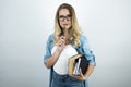 Smart young woman in glasses holding books and pen white background Royalty Free Stock Photo