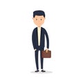 Smartly dressed businessman, smiling. A handsome young businessman holding his briefcase while standing.