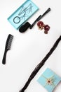 Smartphone Accessories and hair pins flat lay. Sponge for hair, hairdo babette. necklaces of beads or flowers, tiffany blue boxes