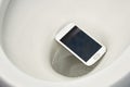 A smartphone accidentally fell into the toilet Royalty Free Stock Photo